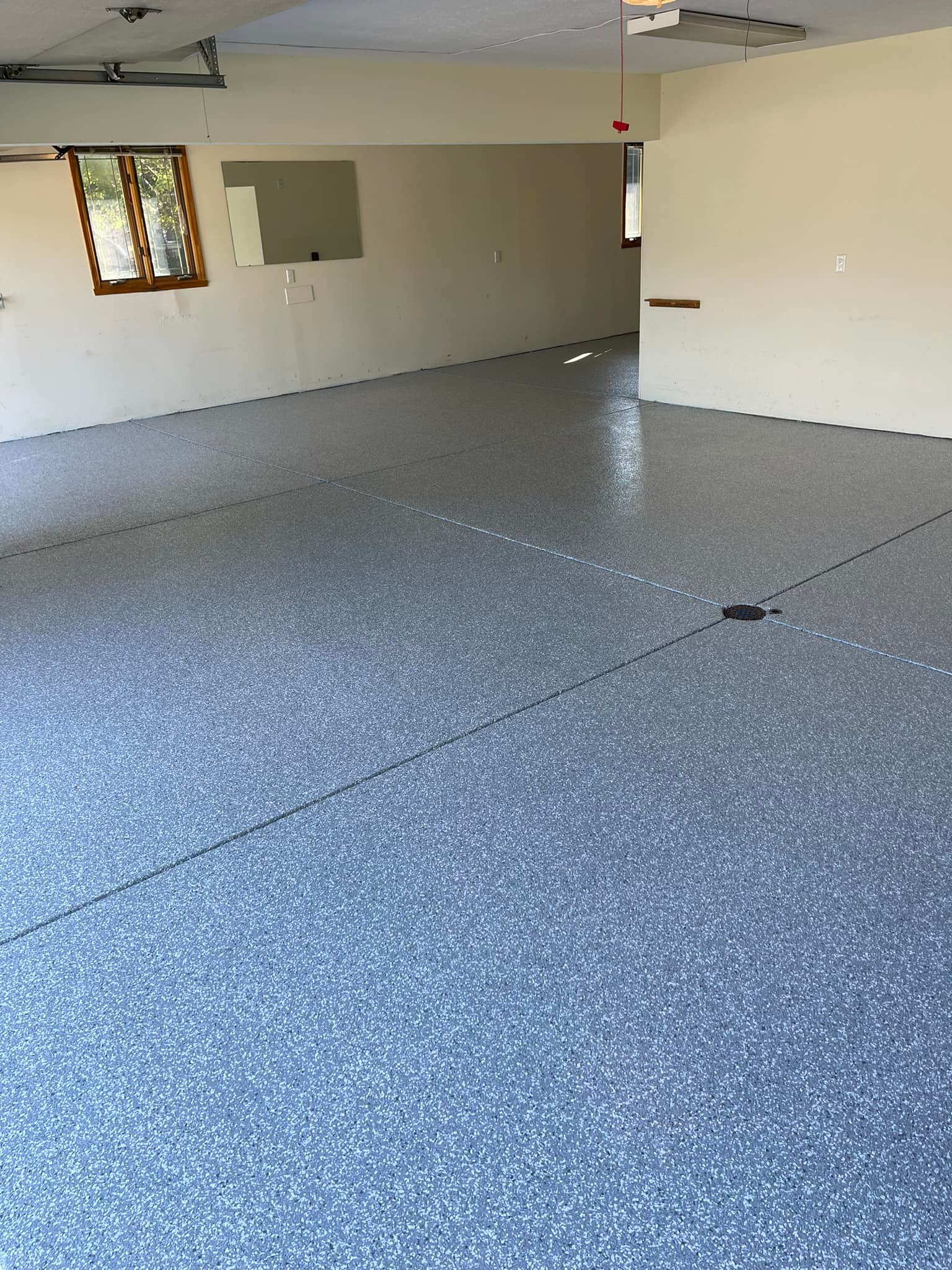 Blue flake epoxy garage floor by Infinity Custom Flooring